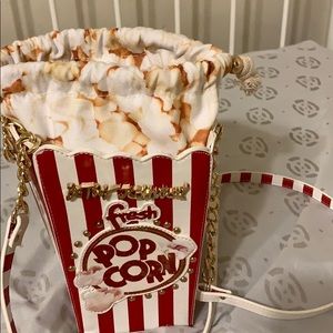 Fits iPhonexr, wallet, keys and popcorn!